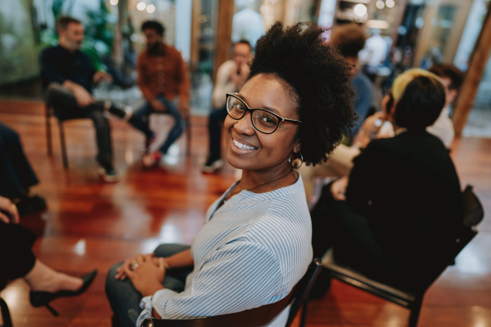 Portrait of smiling woman in emotional support group