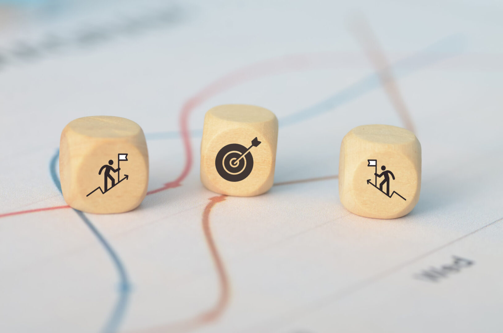 a wooden block to mark their goal target, contrasting it with the rival businessmans position, to highlight their competitive edge.