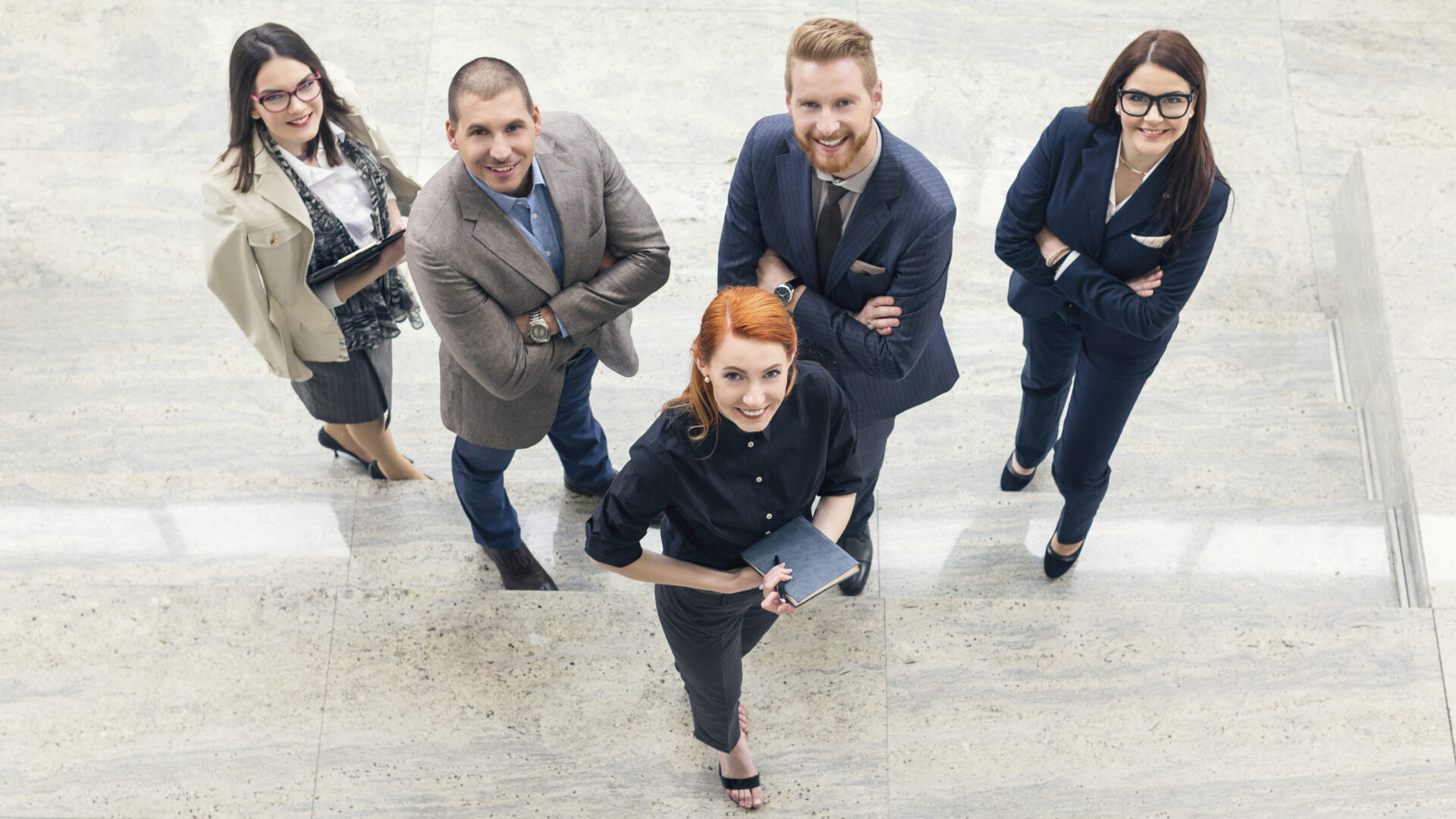 Business people at work. Shallow DOF. Developed from RAW; retouched with special care and attention; Small amount of grain added for best final impression.16 bit Adobe RGB color profile.